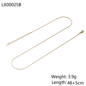Macro view of a 48cm polished gold snake chain necklace showing fine metallic link texture