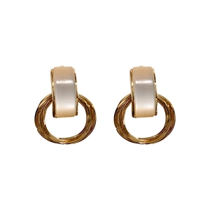 Retro geometric gold hoop earrings with white faux cat-eye stone for an elegant look