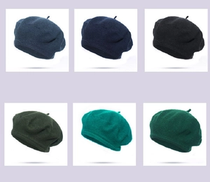 Selection of classic wool berets in various green, navy, and black shades for winter