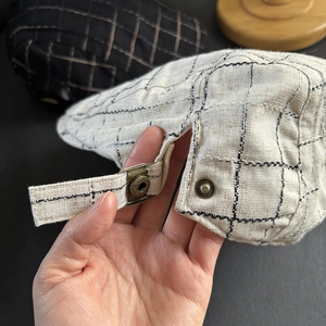 Linen blend flat cap with adjustable bronze side buckle and breathable plaid pattern