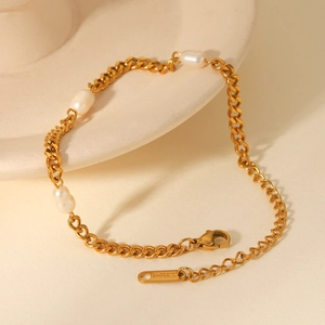 Detailed macro view of 18K gold stainless steel Cuban chain with freshwater pearls