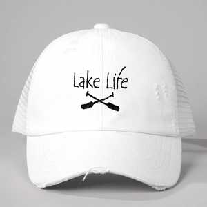 Detail of white distressed baseball cap featuring Lake Life embroidery and mesh back