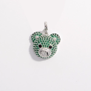 Detailed view of green crystal paved bear charm with silver polished metal accents
