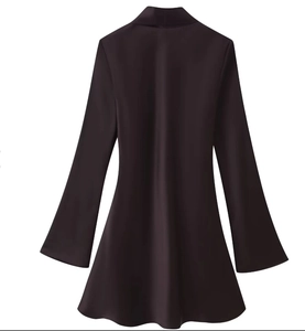 Detailed view of dark brown satin dress with classic lapel collar and slim fit tailoring