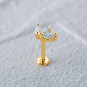 Macro view of S925 silver stud with opal stones and engraved certification mark