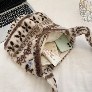 Detail view showing spacious interior of the plush tote bag with daily essentials
