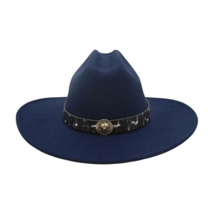 Detail of dark blue felt cowboy hat featuring a golden lion head emblem on decorative band