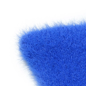 Detail shot of bright blue plush faux mink fur material with soft dense textures
