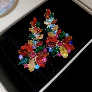 Macro detail of vibrant crystal flower earrings with colorful marquise rhinestones