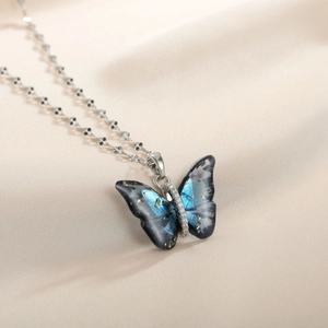Elegant titanium steel necklace featuring a gradient blue butterfly pendant with tiny zircons