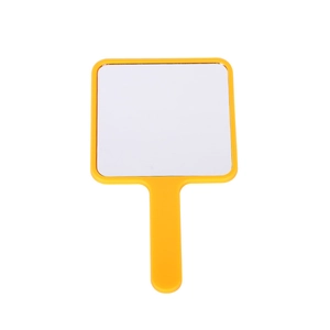 Square yellow handheld makeup mirror with sleek plastic frame on a plain white backdrop