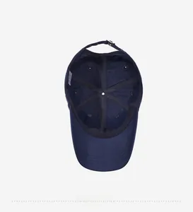 Detailed interior view of navy sports cap with reinforced seams and adjustable metal strap