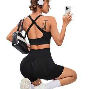 Seamless peach lift yoga shorts and sports bra set in solid black for gym workouts