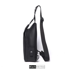 Side view of black crossbody chest bag with USB charging port and breathable mesh back