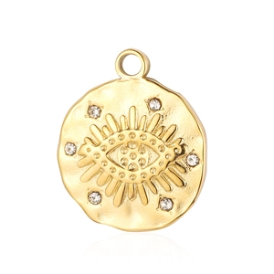 Close-up of gold stainless steel evil eye pendant with crystal inlay and sunburst design