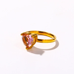 Detailed view of pink heart-shaped zircon ring with 18k gold plated four-prong setting
