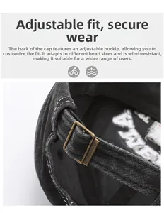 Detail of adjustable metal buckle on vintage washed cotton black baseball cap back