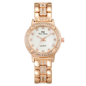 Fashion rose gold quartz watch for women with rhinestone markers and pearl white dial