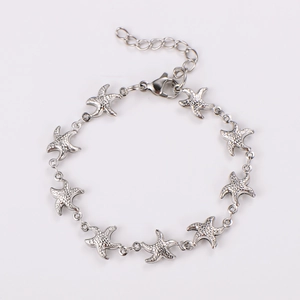 Detailed close-up of starfish link bracelet with lobster clasp and adjustable chain
