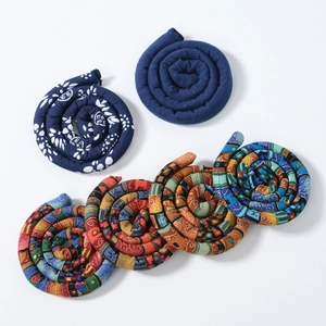 Flat lay set of five ethnic style wire headbands in assorted floral and patchwork patterns