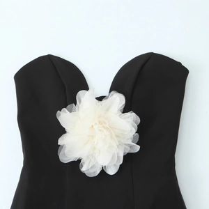 Women's sexy backless bandeau top in black featuring a large white 3D floral accent