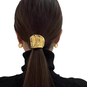 Golden wavy lava ponytail clip and matching hoop earrings set for stylish women