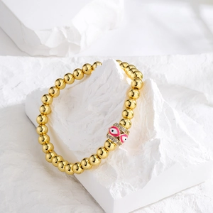 18K gold plated beaded bracelet with pink enamel evil eye charm and sparkling zircons