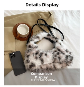 Detail of plush leopard print crescent bag with sleek black strap on a stylish background