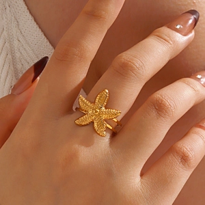 Minimalist gold starfish open ring with textured detail for beach vacation style