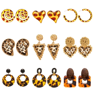 Set of 9 leopard print resin hoop and heart earrings with gold metal accents