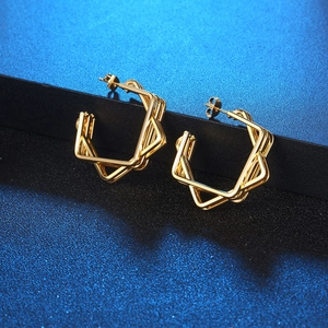 Modern layered geometric gold hoop earrings with intertwined square metal frames
