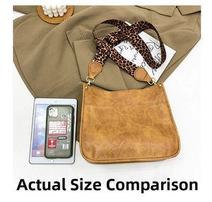 Flat lay of caramel tote bag with leopard strap on blazer with iPad and accessories