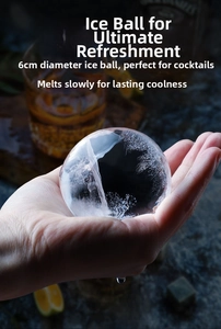 Detailed view of a crystal clear 6cm spherical ice ball for whiskey cocktails