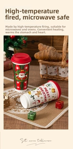 Close-up of a festive ceramic Christmas travel mug with Santa and snowman motifs