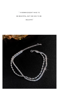 Detail of silver double-layered bracelet with beaded chain and lobster clasp