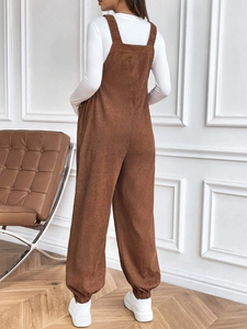 Loose brown corduroy maternity overalls with adjustable waist and classic strap design