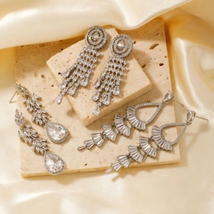 Three pairs of elegant silver tassel drop earrings with sparkling cubic zirconia stones