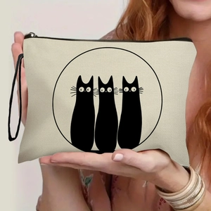 Portable beige canvas makeup bag with minimalist black cat prints and a sturdy wrist strap
