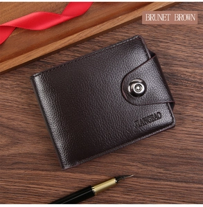 Brunet brown leather bifold wallet with snap closure on premium wooden desk