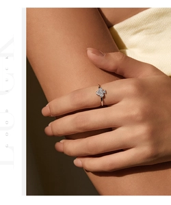 Close-up of S925 silver clover ring with micropave diamonds on a model's finger
