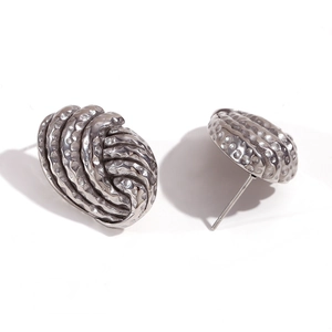 Hammered button stud earrings in titanium steel with a silver-tone spiral shell pattern