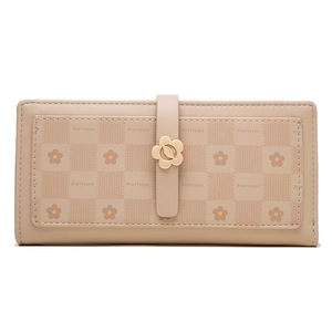 Detail of floral metal buckle and debossed floral checkered pattern on long wallet
