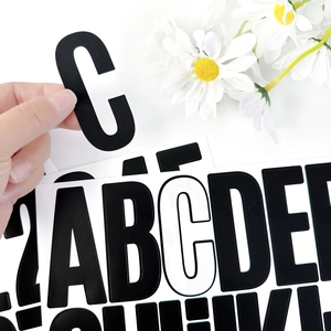 Detail of 3-inch waterproof alphabet stickers showing easy peeling from white background