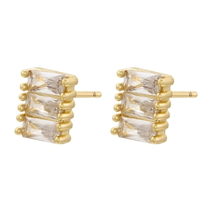 Macro view of gold stud earrings featuring triple stacked rectangular clear zircons