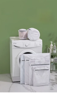 Detail of honeycomb mesh laundry bags with protective zipper covers for delicate wash