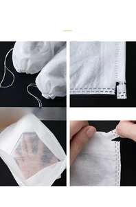 Detail view of non-woven shoe dust bag showing drawstring closure and reinforced edges