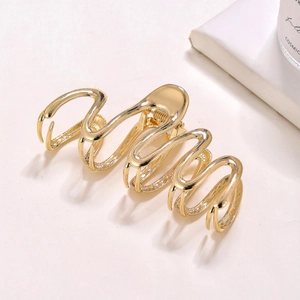 Elegant gold metal snake shape hair claw clip with a polished finish and minimalist design