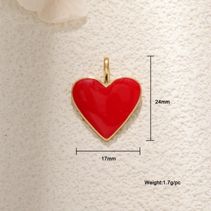 Macro detail of red heart pendant showing 24mm height and 17mm width dimensions