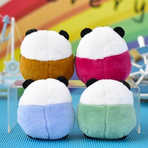 Macro view showing the soft texture and back detail of colorful panda plush charms