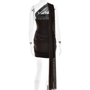 Detail of brown ruched mini dress featuring a sheer mesh shoulder sash on a mannequin